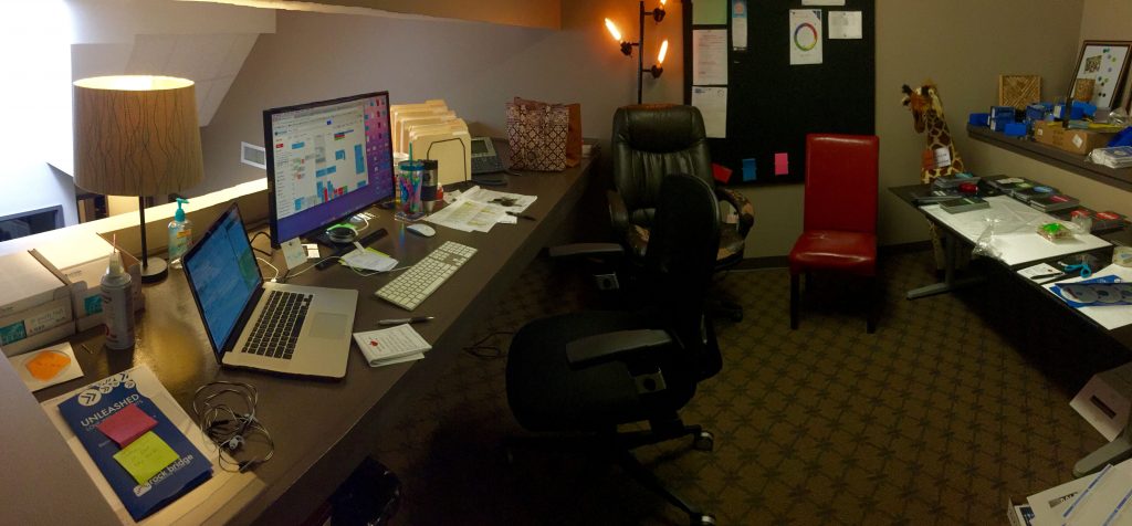 Click to see a panoramic view of Sarah's shared work space.